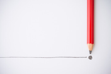 Flat lay of red colour pencil write line and end point on white paper background copy space....