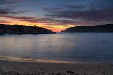 Colourful High Cloud Sunrise Seascape and Rock Formations