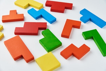 Different wooden blocks on white background. Concept of logical thinking and education
