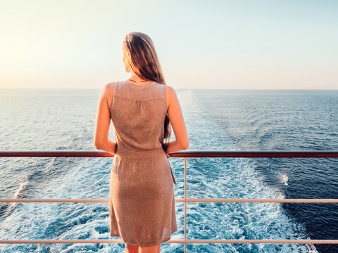 Beautiful woman standing on the deck of a cruise ship. Close-up. Vacation  and travel concept Stock Photo | Adobe Stock