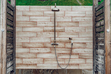 Outdoor rain shower in resort hotel close up