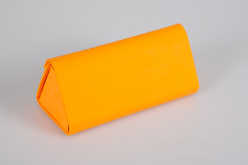 case for glasses orange box for eyeglasses isolated on grey background