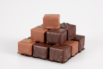 variety chocolate pralines in pyramid view in white background