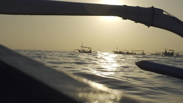 Outrigger Boats On Sea At Sunset In Bali