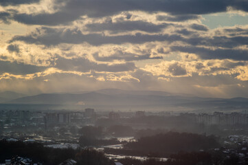 City from a height in smog on a winter day