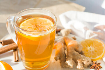 Autumn hot tea with lemon and spices