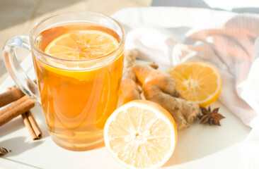 Autumn hot tea with lemon and spices