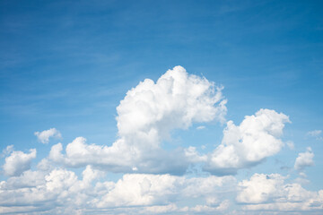 White clouds with blue sky background copy space. Sunshine day with beautiful clouds.
