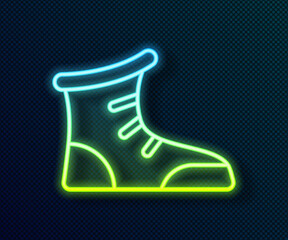 Glowing neon line Sport boxing shoes icon isolated on black background. Wrestling shoes. Vector.