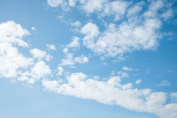White clouds with blue sky background copy space. Sunshine day with beautiful clouds.