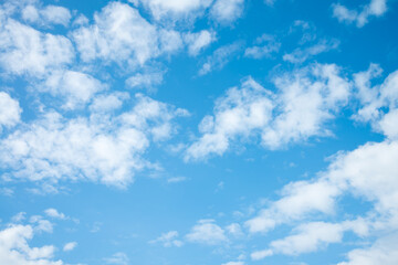 White clouds with blue sky background copy space. Sunshine day with beautiful clouds.
