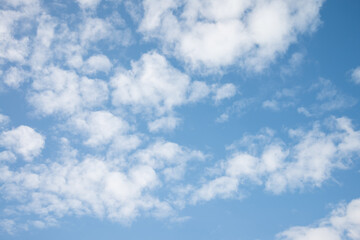 White clouds with blue sky background copy space. Sunshine day with beautiful clouds.