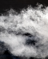 Fototapeta premium White smoke on a black background. Texture