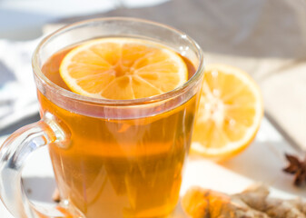 Autumn hot tea with lemon and spices