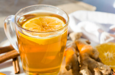 Autumn hot tea with lemon and spices
