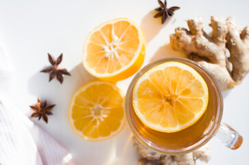 Fototapeta na wymiar Autumn hot tea with lemon and spices