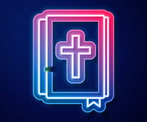 Glowing neon line Holy bible book icon isolated on blue background. Vector.