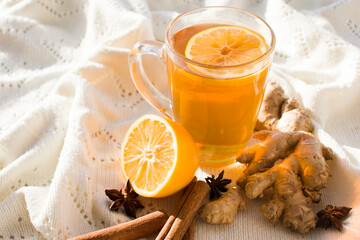 Autumn hot tea with lemon and spices