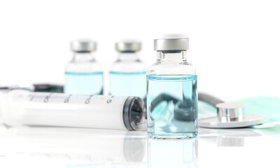 Antiviral vaccine bottle and medical stethoscope Syringe on a white background