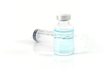Antiviral vaccine bottle and medical Syringe on a white background