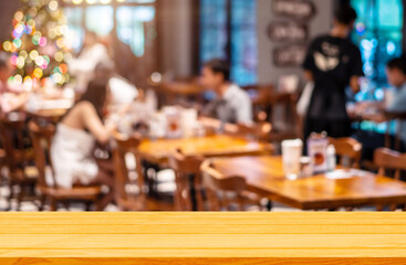 Empty wooden table background of free space for your on blur cafe restaurant in dark background, For montage product display