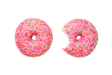 Two Pink frosted donuts with colorful sprinkles isolated on white background.