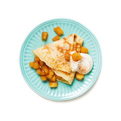 Crepes, thin pancakes with caramelized apple filling and cream fresh. isolated on white background