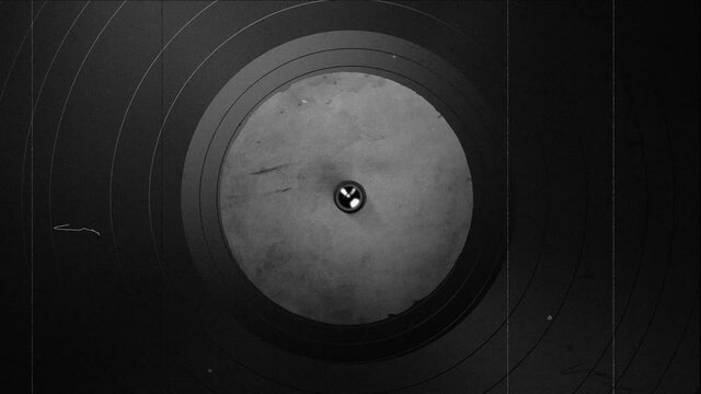 Close up footage of black vinyl record on turntable, 4k loop footage with old film effect