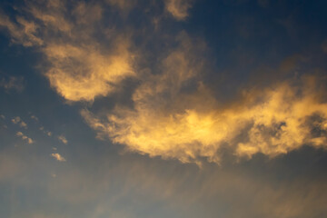 Beautiful clouds in the sunset sky. Close-up.