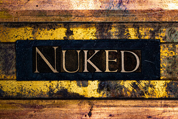 Nuked text on grungy textured authentic copper and gold background lined with bronze bars