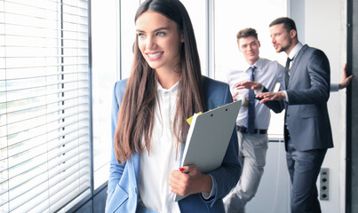 Portrait young business woman on the background of the office.