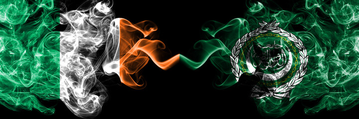 Republic of Ireland, Irish vs Arab League smoky mystic flags placed side by side. Thick colored silky abstract smoke flags.