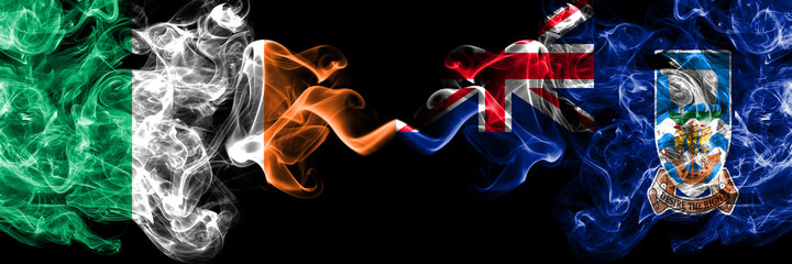 Republic of Ireland, Irish vs British, Britain, Falkland Islands smoky mystic flags placed side by side. Thick colored silky abstract smoke flags.