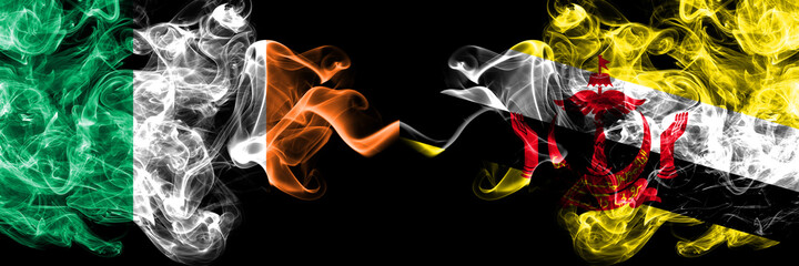 Republic of Ireland, Irish vs Brunei, Bruneian smoky mystic flags placed side by side. Thick colored silky abstract smoke flags.