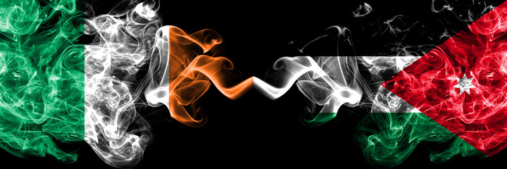 Republic of Ireland, Irish vs Jordan, Jordanian smoky mystic flags placed side by side. Thick colored silky abstract smoke flags.