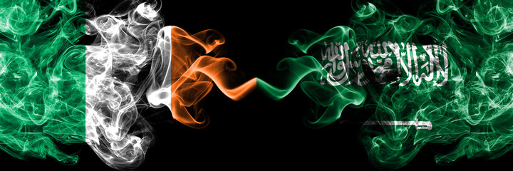 Republic of Ireland, Irish vs Saudi Arabia, Arabian smoky mystic flags placed side by side. Thick colored silky abstract smoke flags.