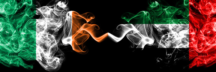 Republic of Ireland, Irish vs United Arab Emirates, Emirati smoky mystic flags placed side by side. Thick colored silky abstract smoke flags.