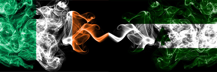 Republic of Ireland, Irish vs United States of America, America, US, USA, American, Greenbelt, Maryland smoky mystic flags placed side by side. Thick colored silky abstract smoke flags.
