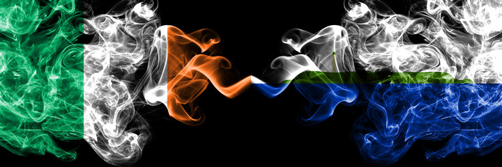 Republic of Ireland, Irish vs United States of America, America, US, USA, American, Navassa Island smoky mystic flags placed side by side. Thick colored silky abstract smoke flags.