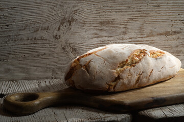 Bread at leaven. Fresh homemade  bread on wooden background