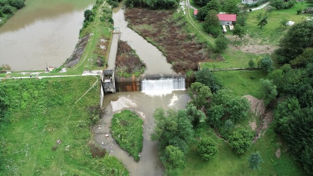 Artificial mini-waterfall between the mountains seen from above