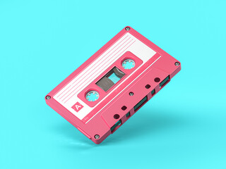 Pink vintage audio cassette on blue background.