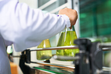 Worker was hold bottle of sweat fancy water in drinking industrial