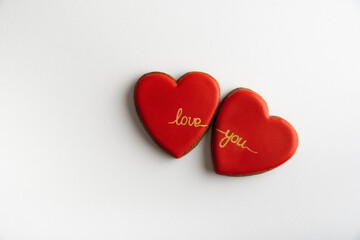 Two red hearts with the words Love you on white background, top view. Valentines day