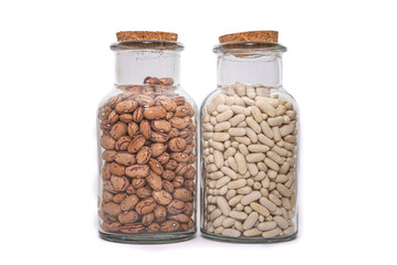 White Beans And Borlotti Bean dried and preserved in glass jars isolated on a white background. Healthy nutritional preserved ingredients.
