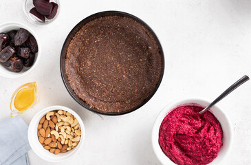 flat lay composition with ingredients for cooking vegan beetroot cake. Healthy vegan food concept. White background. copy space.