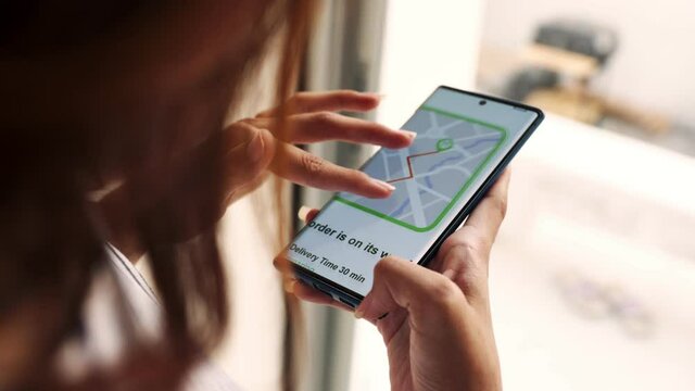 The delivery service will bring packages from the grocery store home to the customer.Meetsing Delivery Man who Gives Her Cardboard Box Postal Package, She Signs Electronic Signature POD Device. 