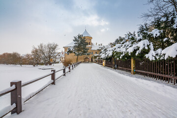 View of Telc castle in winter, during snowfalling. Historical building is part of UNESCO heritage. Czech Republic.