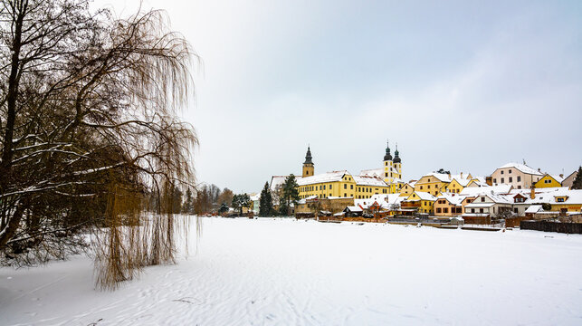 View of Telc castle in winter, during snowfalling. Historical building is part of UNESCO heritage. Czech Republic.