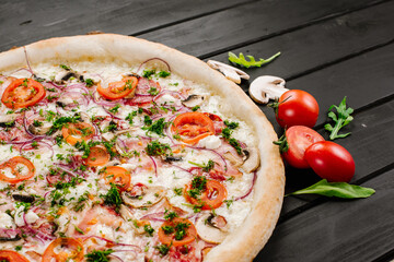 Tasty fresh pizza with ingredients on wooden background